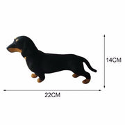 Plush dachshund toy with measurements on a white background